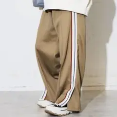コンバーストウキョー　SIDE LINE LOOSE TRACK PANTS