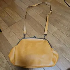 オレンジ がま口 バッグ