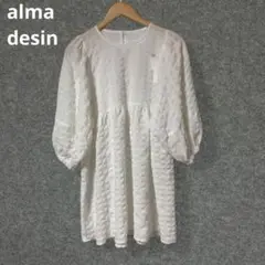 alma desin ポンチ素材 白いチェック模様の五分袖チュニック