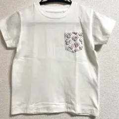ユニクロKAWSホワイト Tシャツ ポケットキャラクター柄