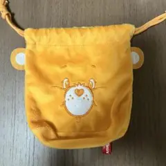ケアベアふわふわフェイス巾着オレンジ（ガチャガチャ）
