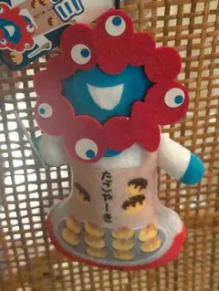 ♥。未使用品「ミャクミャク たこやーき人形」吊り紐付き。