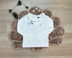 BeBe ネックレスプリントフリルTシャツ　ホワイト　120cm