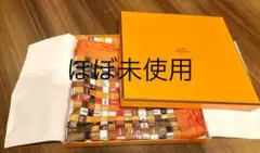 エルメス ボルデュック 90センチ カレ スカーフ ロゴ リボン柄 オレンジ