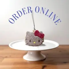 新品未使用サンリオ日焼けキティkitty小物ケースリボン赤