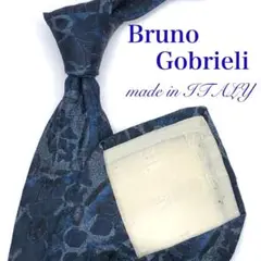 【大特価】Bruno Gobrieli ネクタイ 総柄 ブルー ロゴ 光沢感