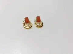 オレンジとゴールドのフープピアス