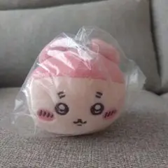 ピンクの顔付きぬいぐるみ