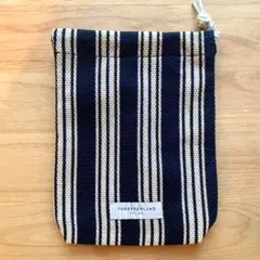 TOMORROWLAND オリジナルファブリック製巾着。