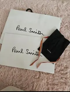Paul Smithのロゴ入り袋とポーチのセット。