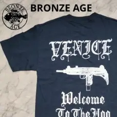 ブロンズエイジ BRONZE AGE Tシャツ UZIバックプリント