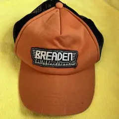 BREADEN トラッカーキャップ オレンジ/ブラック