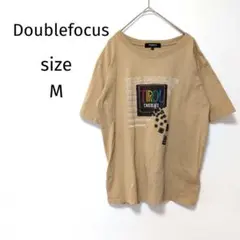 ダブルフォーカス Doublefocus Tシャツ チロルチョコ ベージュ M