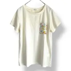 チュチュアンナ　花柄の胸ポケット　Tシャツ　クリーム色　アイボリー　クルーネック