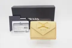 PRADA 三つ折り財布 リボン サフィアーノ レザー コンパクトウォレット 黄