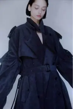 stein deformation trench coat concrete