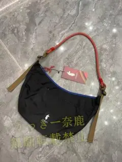 cotopaxi 黒いショルダーバッグ 赤いロープハンドル