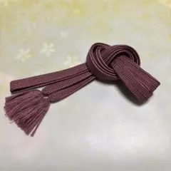 紫色の編み込み帯締め 房付き