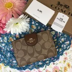 COACH 二つ折財布 シグネチャー ブラウン ロゴベルト