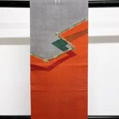 朱色の紬地にスワトウ刺繍の洒落帯 着物 袋帯