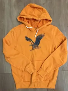 アメリカンイーグルAMERICAN EAGLE オレンジパーカー S