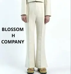 BLOSSOM H COMPANY ホワイト フレアパンツ スリット