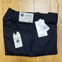 トゥモローランド バックシャーリングスリムテーパードパンツ
