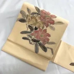 九寸名古屋帯 山科春宣 正絹 薄い洒落柿色 花 手描き 作家 落款 柔らかい