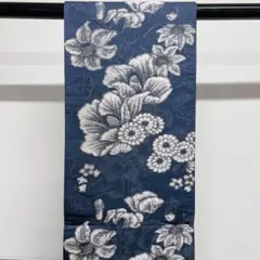 藍色に白色で百合を初め様々な花が織られた袋帯 着物