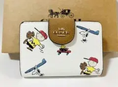 新品COACH コーチ 二つ折り財布 peanutsコラボ スヌーピー