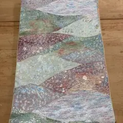 ベージュオレンジベースの名古屋帯