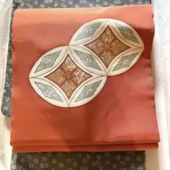 可愛い錆朱の名古屋帯 塩瀬