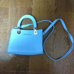 ライトブルー ショルダーバッグ 編み込みハンドル