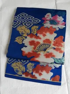 瑠璃色に花柄と幾何学的模様のアンティーク名古屋帯