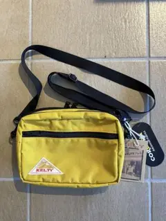 KELTY ケルティ　RECTANGLE ZIP SHOULDER マスタード