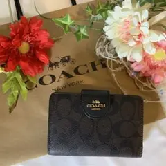 COACH コーチ 二つ折り財布 ブラウン ブラック ボタンロゴ