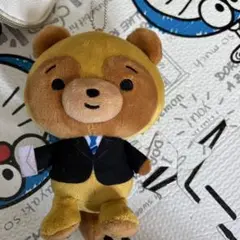 スーツを着たクマのマスコット