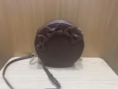 リボン付きブラウンラウンドバッグ