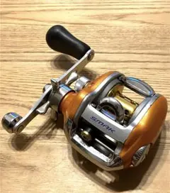 Daiwa SMAK 100L 両軸リール オレンジ ダイワ リール/両軸リール/スマック100R/L