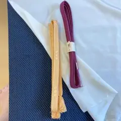 オレンジ色と紫色の帯締め