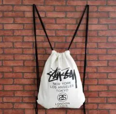 STUSSYドローストリングバック グラフィックプリント