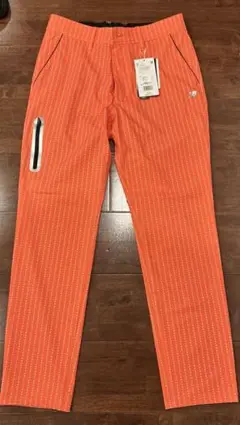 50%引き!! ニューバランス ゴルフ パンツ オレンジ