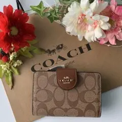 COACH コーチ 二つ折り財布 カーキ サドルブラウン ベージュ ボタンロゴ