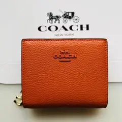 COACH コーチ折りたたみ財布 可愛い オレンジ色 ミニ財布 おすすめ