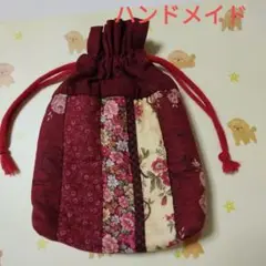 ハンドメイド、赤系花柄パッチワーク巾着袋（オールシーズン)