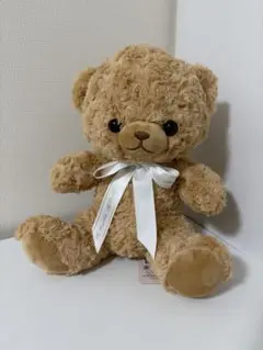 ベージュのクマのぬいぐるみ