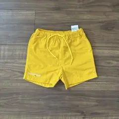 美品 モンベル キッズ バギーズショーツイエロー