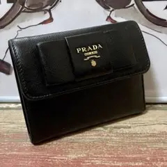 プラダ 三つ折り財布 リボン サフイーアノレザー