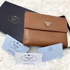 人気・箱付✨プラダ 二つ折り財布 サフィアーノレザー メタルロゴ ゴールド金具