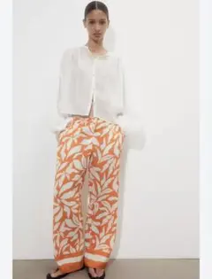 美品【H&M 】ワイドパンツ　モチーフプリント　EUR34 オレンジ